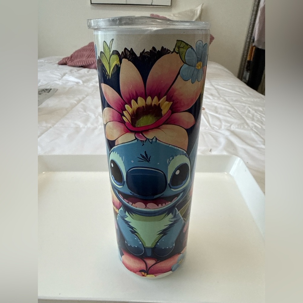 Disney stitch, floral insulated stainless steel travel Tumblr. Holds 24 oz.